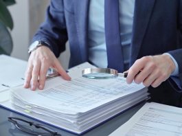 A person looks at papers as the National Council on Problem Gambling (NCPG) releases its latest report.