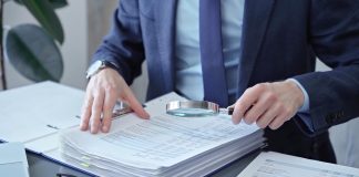 A person looks at papers as the National Council on Problem Gambling (NCPG) releases its latest report.