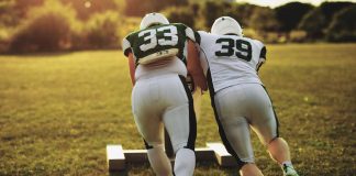 Football season helps push Colorado revenue to $563M for September Football players pushing sled