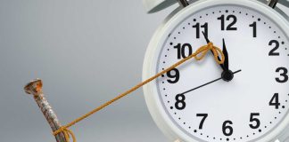 Clock being held by nail