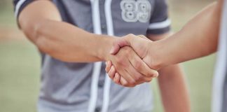 FanDuel and MLBPA reach agreement on player usage rights Baseball players shaking hands