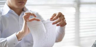 VGW files motion to dismiss in Georgia class action lawsuit Hands ripping up a paper