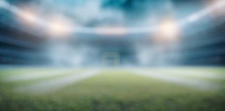 MA regulators question the blurred lines between ESPN and ESPN Bet Blurry football field showing the lack of clarity on sports marketing regulations