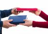 People swapping books, symbolizing CFTC-regulated event contracts