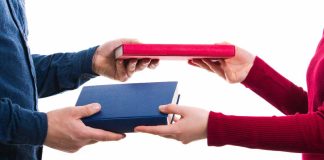 New Jersey AG questions if sports contracts even qualify as legal swaps People swapping books, symbolizing CFTC-regulated event contracts