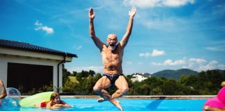 Man jumping in pool like PA poker players are joining shared player pool in the US