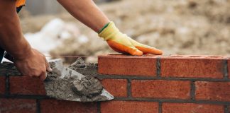 Construction work lays bricks as Better Collective restructures its business