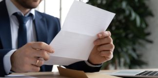 Male opens letter that NBA sent to CFTC about prediction markets