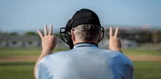 DraftKings last operator standing in battle against MLB players union Umpire displaying full count, representing that DraftKings is the last operator fighting against the MLB Players Union