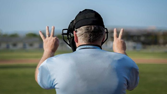Umpire displaying full count, representing that DraftKings is the last operator fighting against the MLB Players Union