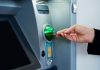 EDGE Markets signs deal with Defy the Odds for finance platform as person puts debit card into ATM