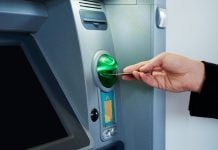 EDGE Markets to expand finance platform with Defy the Odds deal EDGE Markets signs deal with Defy the Odds for finance platform as person puts debit card into ATM