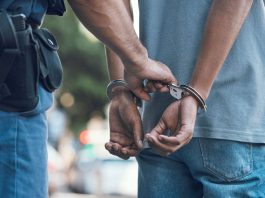 A person being handcuffed, much like an illegal gambling operator would be in Nevada
