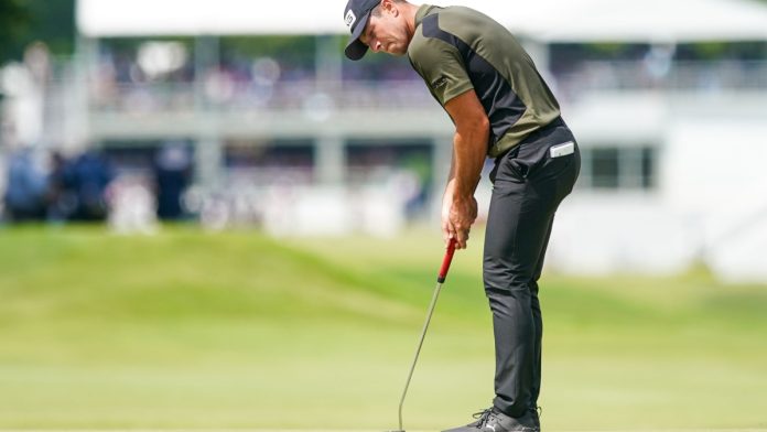 PGA Tour player Viktor Hovland prepares for a shot as PENN debuts a new PGA TOUR-themed online casino game.