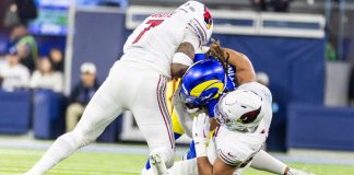 Arizona Cardinals player tackle an opponent