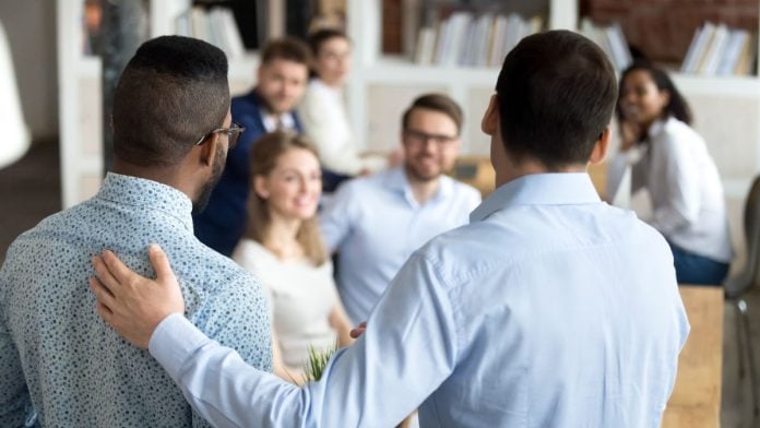 A new member being introduced to a group, just as bet365 has joined the Sports Betting Alliance