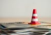 Credit cards with a warning cone as Connecticut considers changes to its payment rules regarding gambling.