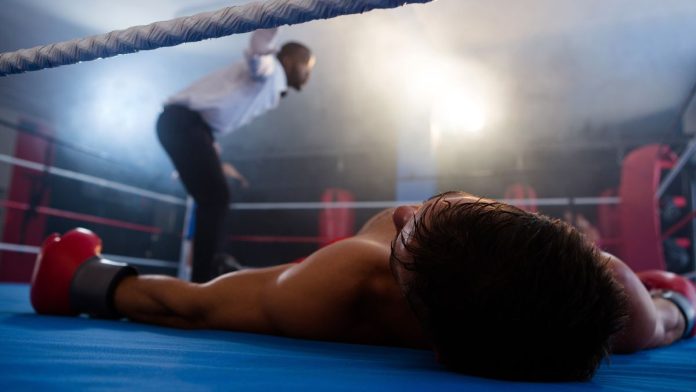Could-California-ban-be-the-knockout-blow-for-sweeps A knocked-out boxer lying on a boxing ring mat