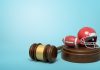 Gavel with tiny football and helmet