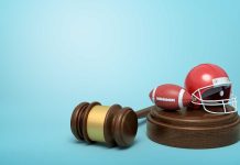 Gavel with tiny football and helmet