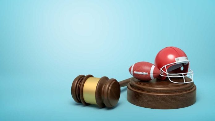 Gavel with tiny football and helmet