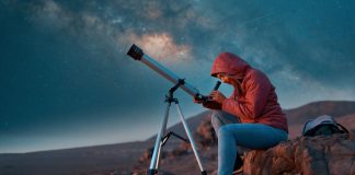 IGT rebrands global lottery business ahead of $6B merger Woman looks through telescope as IGT rebrands its lottery business to Brightstar Lottery.
