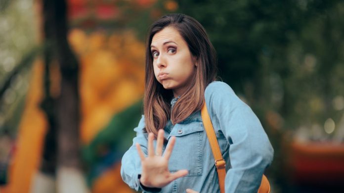 A woman telling someone to stay away