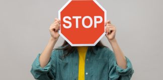 MA attorney general sends cease and desist order to BetOnline A stop sign is being held as BetOnline receives a cease and desist letter.
