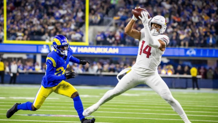 NFL player makes a catch as the league extends its data partnership with Genius Sports.