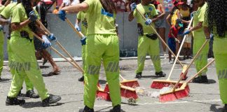 Cleaning crew with brooms