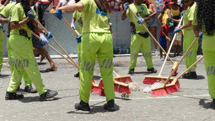 Cleaning crew with brooms
