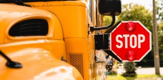 School bus stop sign as New York lawmakers order online sweepstakes casinos to exit the state.