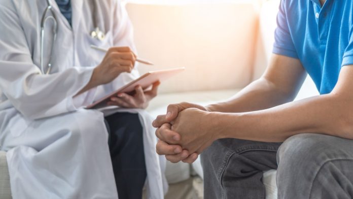 A doctor speaks to a patient as New York (NY) lawmakers consider a bill to provide insurance coverage for problem gambling.