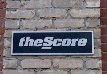 PENN Entertainment cutting over 75 jobs at theScore theScore sign as PENN plans to lay offs works at the gaming brand.