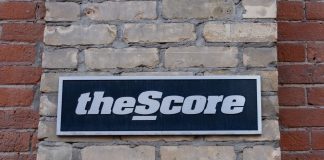 PENN Entertainment cutting over 75 jobs at theScore theScore sign as PENN plans to lay offs works at the gaming brand.