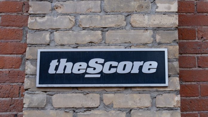 theScore sign as PENN plans to lay offs works at the gaming brand.