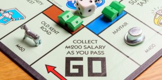 Legislation to open Rhode Island sports betting fails to progress A monopoly board is being played as Rhode Island will maintain a sports betting monopoly in the state.