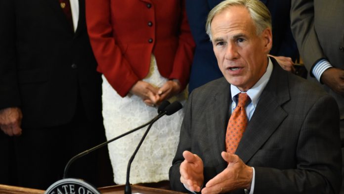Texas Gov. Greg Abbott speaks as he awaits to consider a bill to overhaul the Texas lottery.
