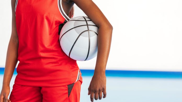 Women's basketball player stands as bet365 partners with the WNBA's Chicago Sky.