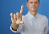 A man wagging his finger in a "no" gesture