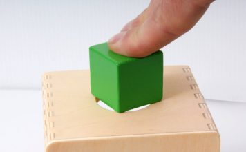 A person trying to fit a square peg in a round hole