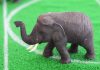 Elephant toy on a soccer field