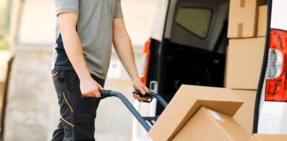 A delivery man handles packages as Bragg Gaming delivers new games to Fanatics Casino.