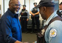 Chicago Mayor Brandon Johnson shakes hands.