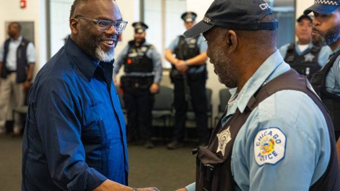 Chicago Mayor Brandon Johnson shakes hands.