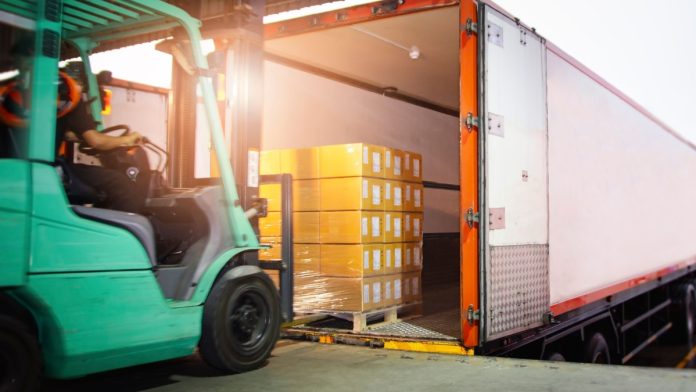 A truck takes off a load of goods as IGT offloads its digital and gaming business.