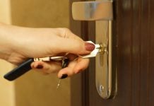 A person puts a key into a door as Kambi and LeoVegas extend their turnkey solutions deal.