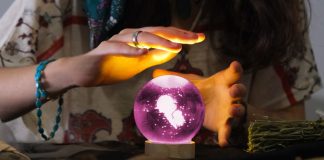 A fortune-teller predicting the future using a crystal ball