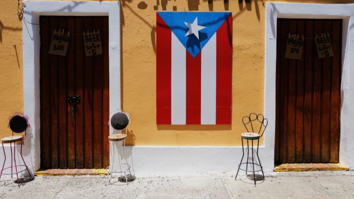 A Puerto Rico flag as PrizePicks secures licenses in the territory and Maine.