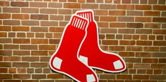 The Boston Red Sox logo on a brick wall